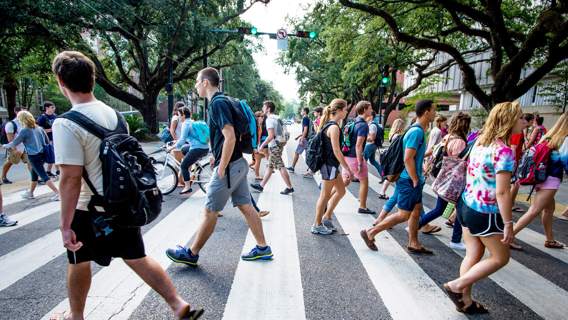 In between classes, students breeze by each other on Freret Street.
